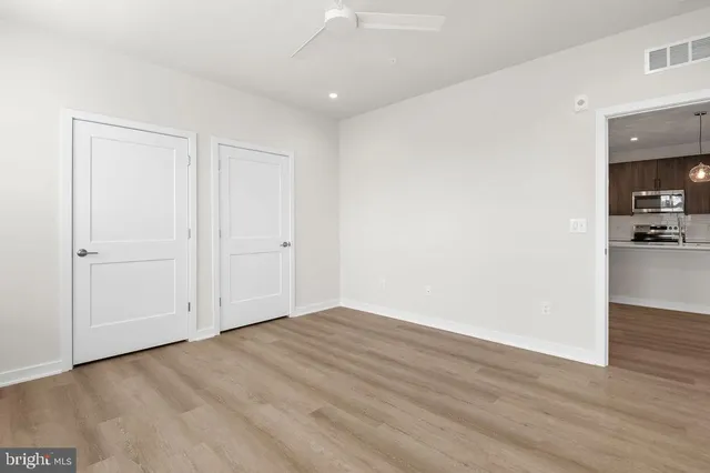 a bathroom with a double vanity sink toilet and shower