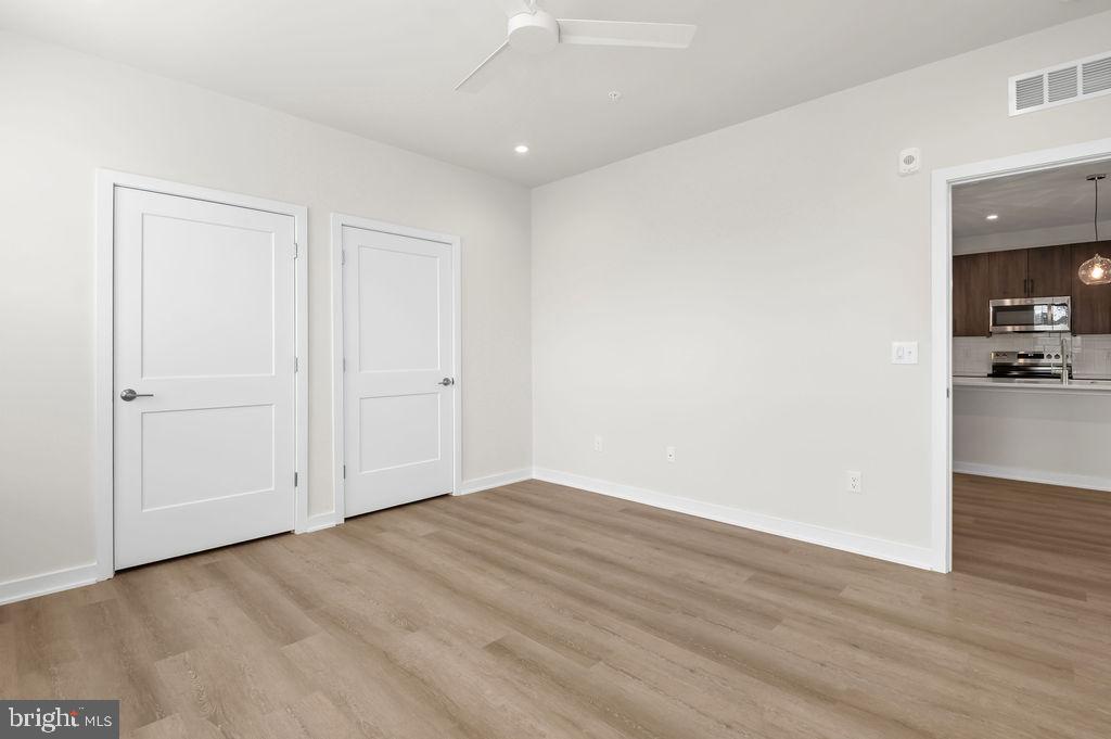 26 South York Road, Unit 210 Hatboro, PA 19040 - Photo 10 of 52 a view of livingroom with hardwood floor and a kitchen space