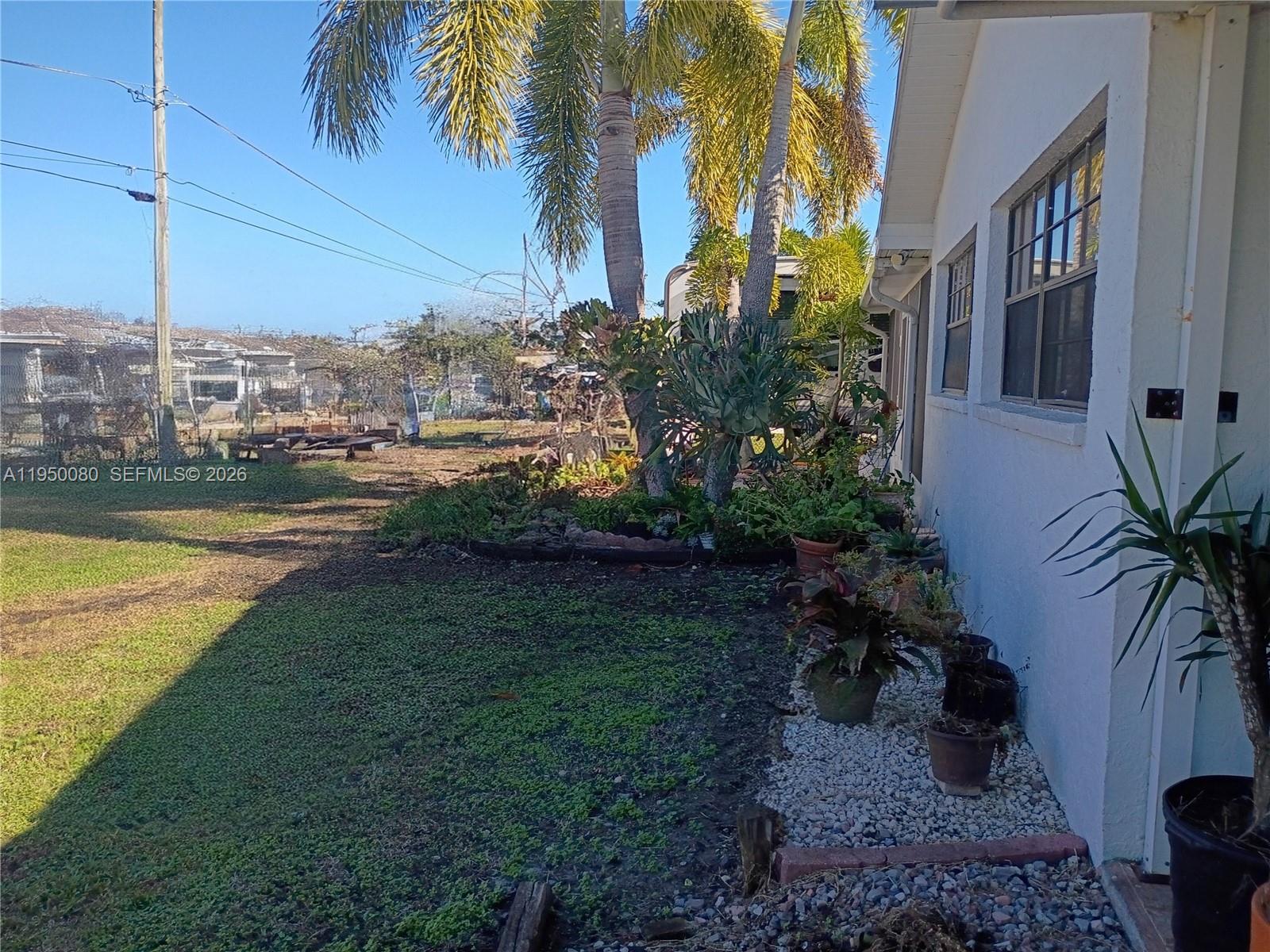 1824 Red Road Clewiston, FL 33440 - Photo 18 of 27 a view of a house with a yard
