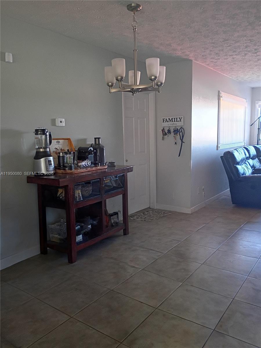 1824 Red Road Clewiston, FL 33440 - Photo 5 of 27 a view of a dining room with furniture