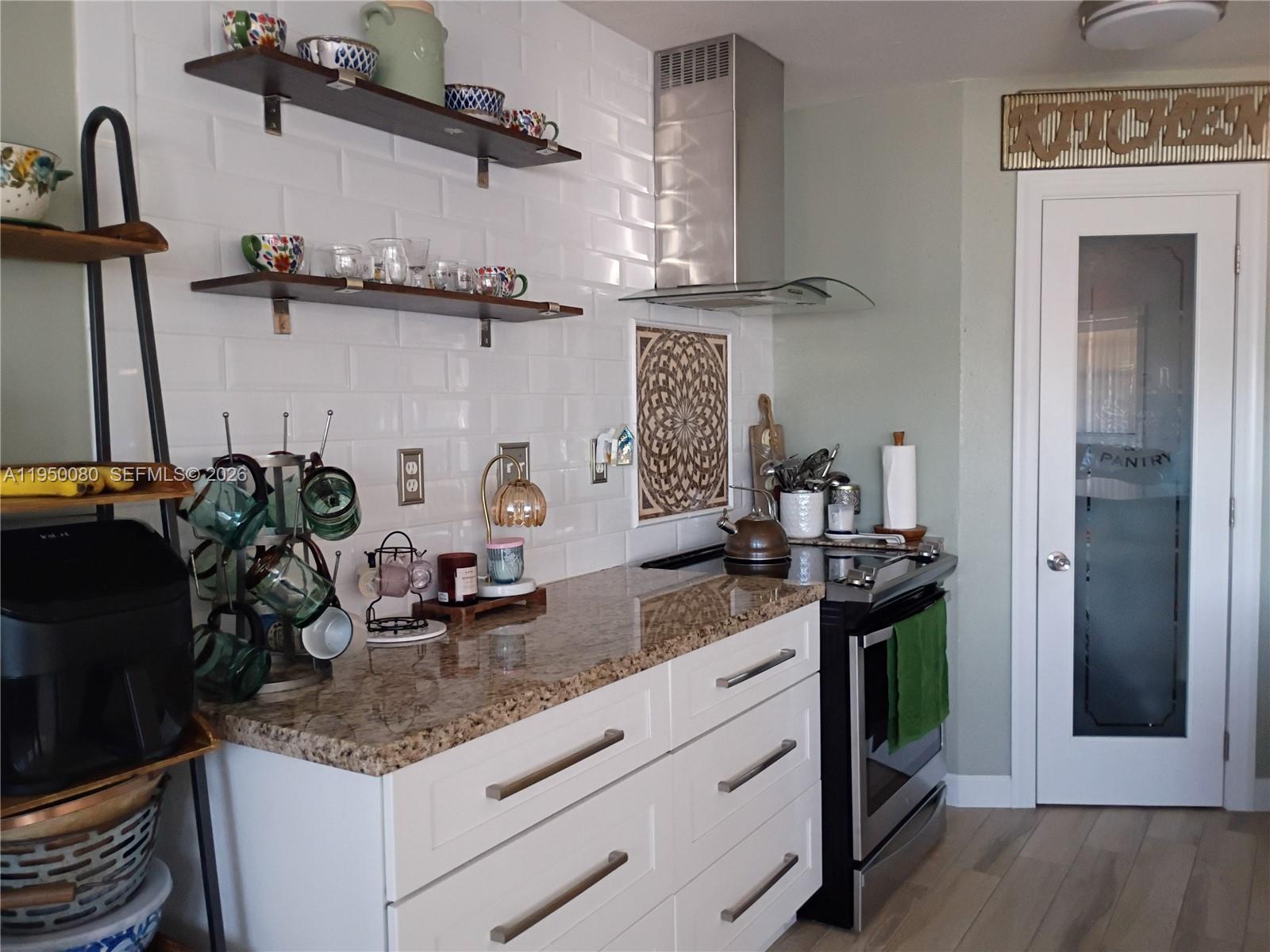 1824 Red Road Clewiston, FL 33440 - Photo 8 of 27 a kitchen with a sink and cabinets