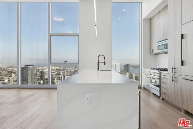a kitchen with counter top space and appliances