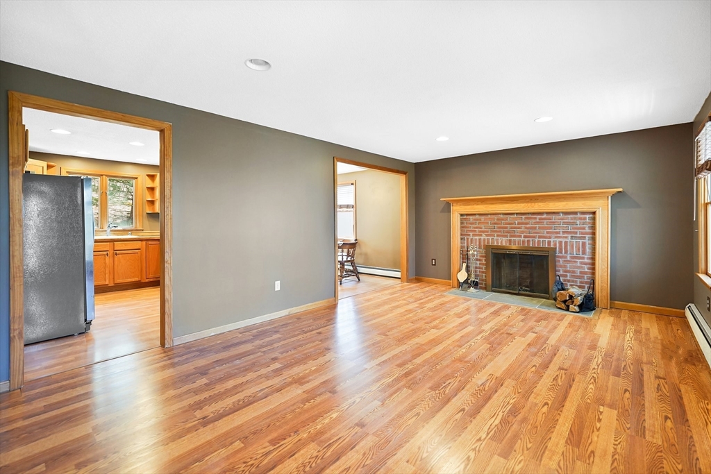 20 Upper Hampden Road Monson, MA 01057 - Photo 12 of 39 a view of an empty room with a fireplace and a window