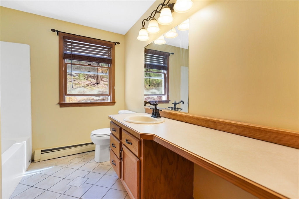 20 Upper Hampden Road Monson, MA 01057 - Photo 16 of 39 a bathroom with a sink a toilet and mirror