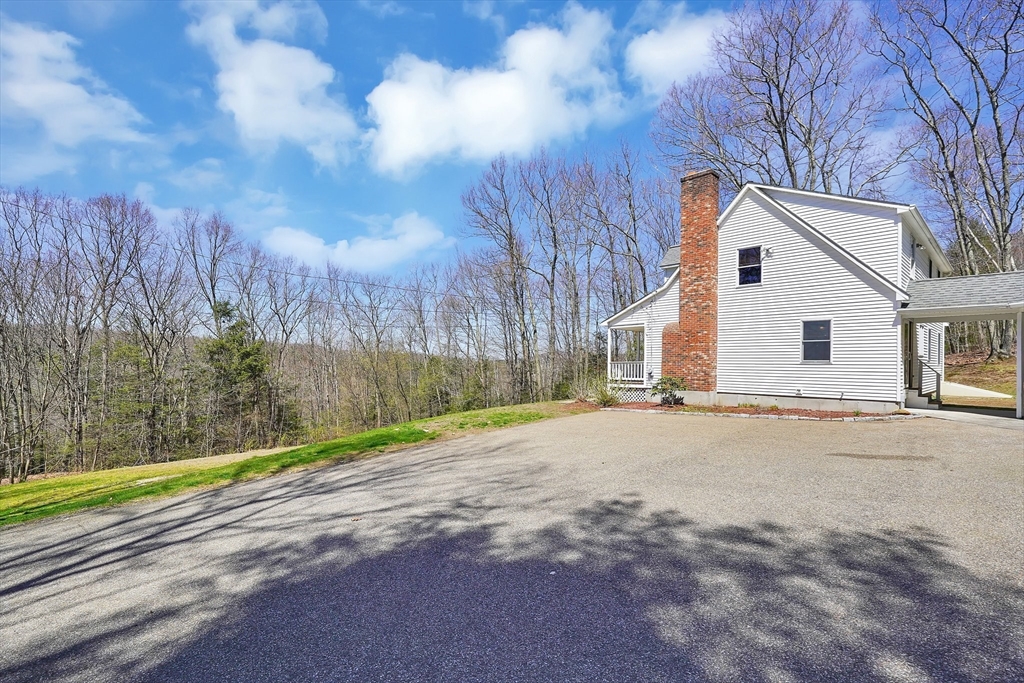 20 Upper Hampden Road Monson, MA 01057 - Photo 35 of 39 a view of a white house with a yard and wooden fence