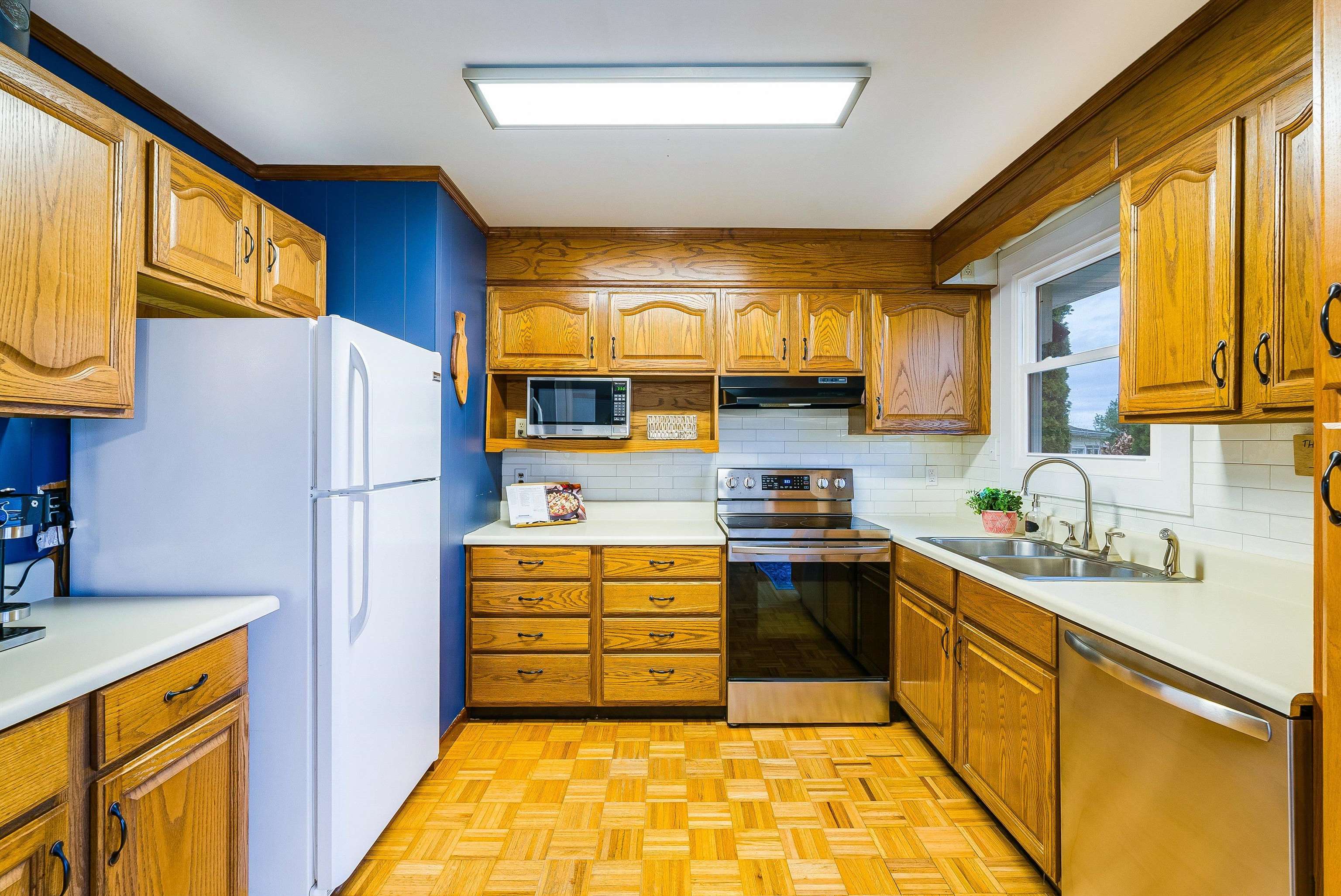 815 Rutherford Street Staunton, VA 24401 - Photo 12 of 56 a kitchen with stainless steel appliances granite countertop a refrigerator sink and stove