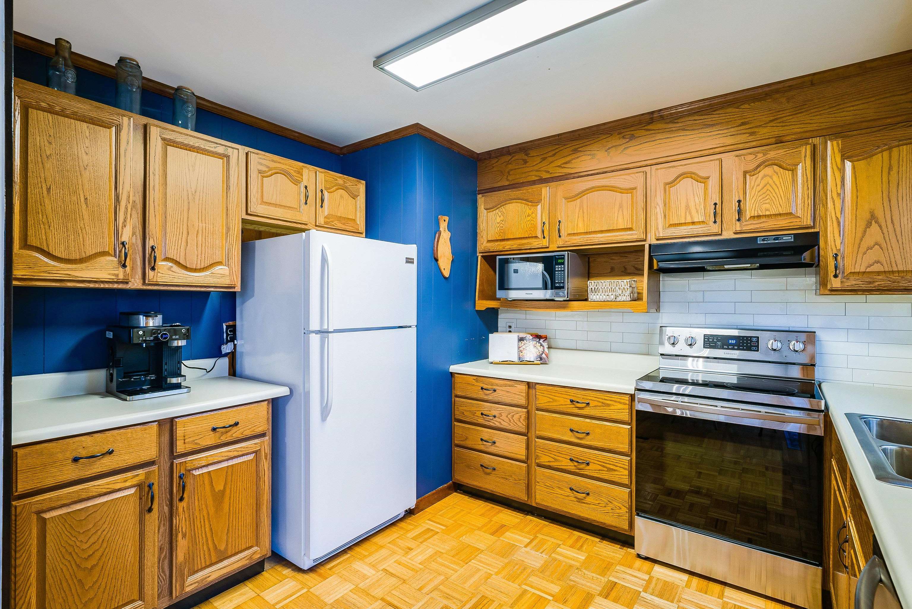 815 Rutherford Street Staunton, VA 24401 - Photo 13 of 56 a kitchen with stainless steel appliances granite countertop a refrigerator and a stove top oven