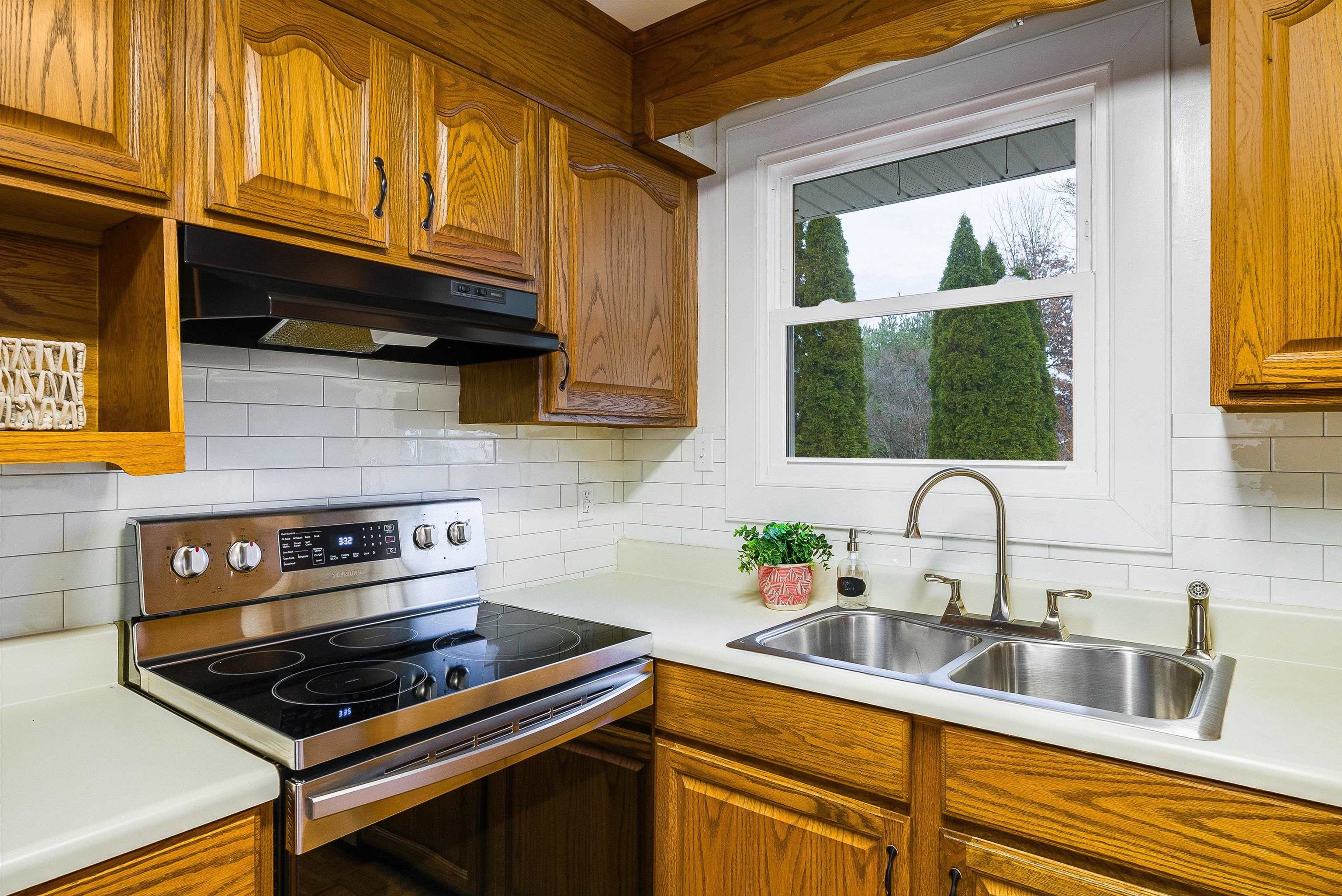 815 Rutherford Street Staunton, VA 24401 - Photo 14 of 56 a kitchen with stainless steel appliances a stove a sink and a cabinets