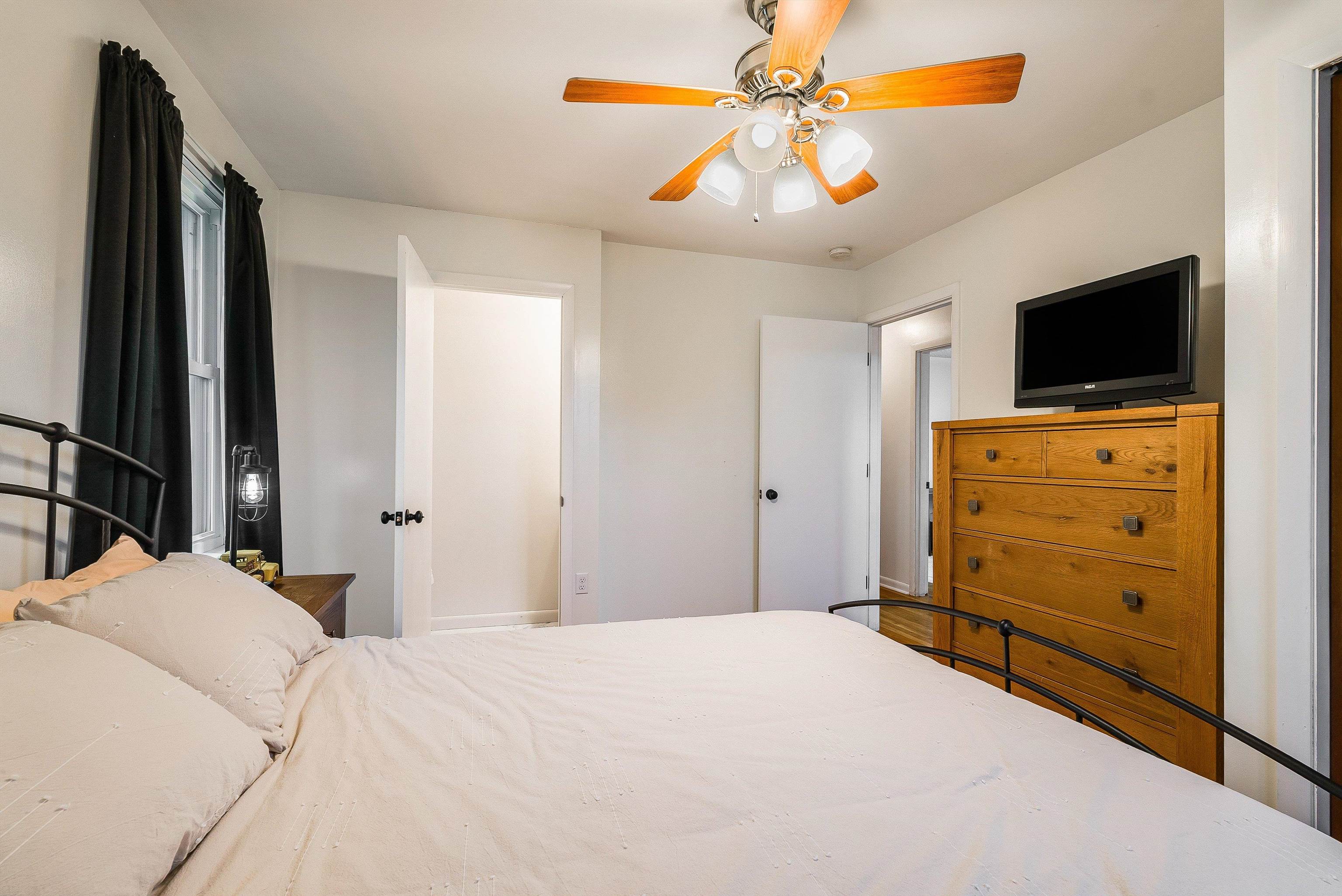 815 Rutherford Street Staunton, VA 24401 - Photo 24 of 56 a bedroom with a bed and a flat screen tv