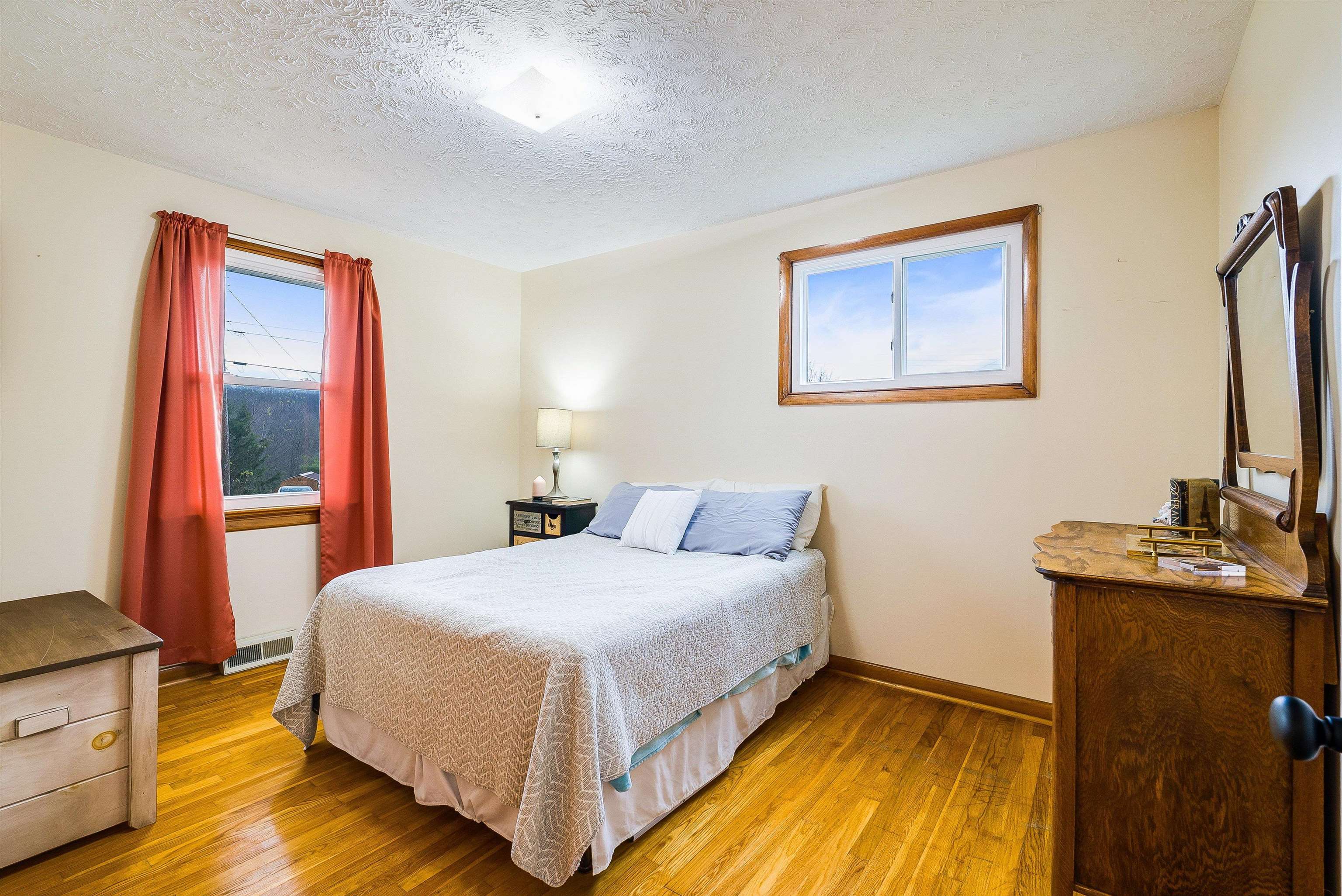 815 Rutherford Street Staunton, VA 24401 - Photo 26 of 56 a bedroom with a bed and a flat tv screen on dresser
