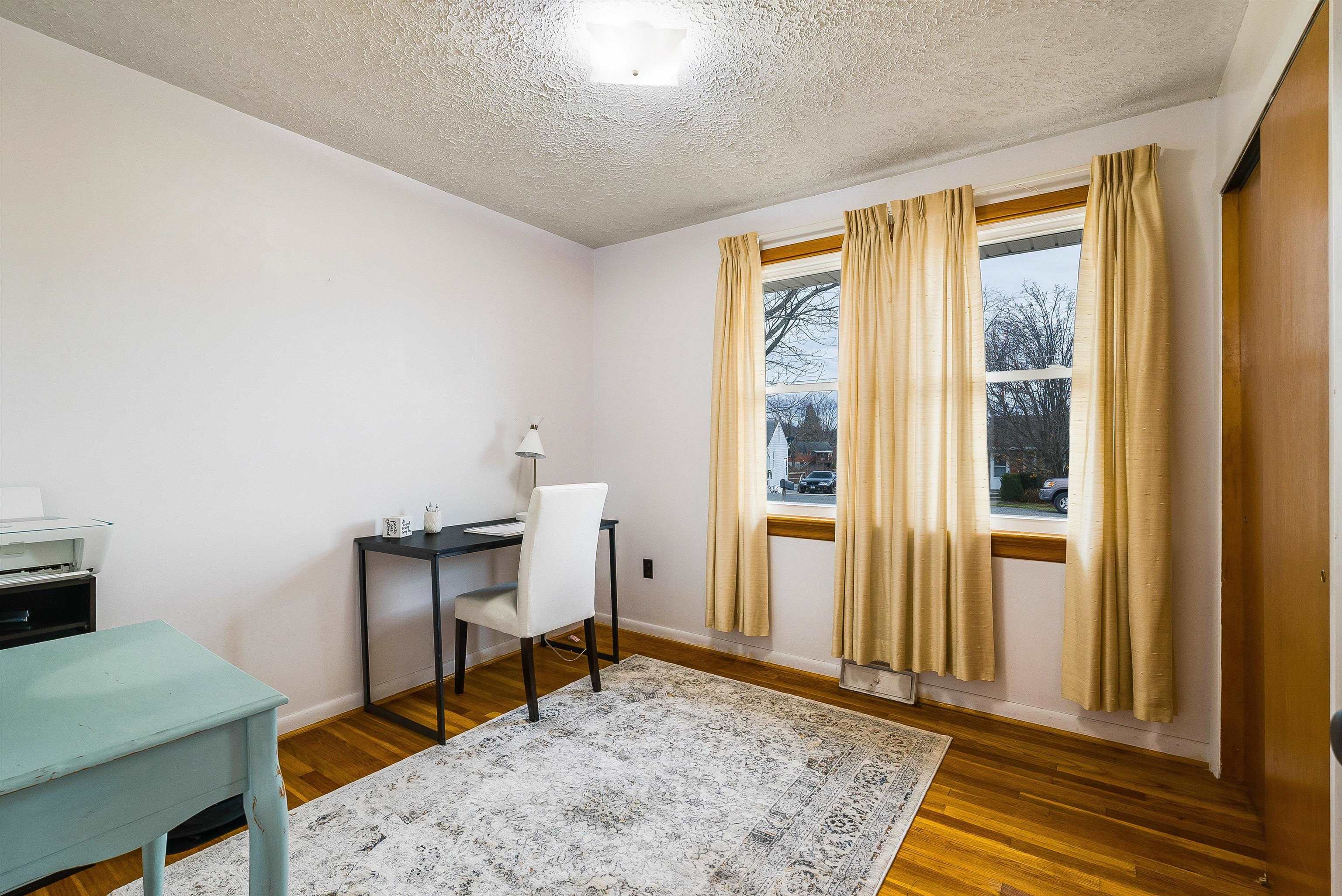 815 Rutherford Street Staunton, VA 24401 - Photo 28 of 56 a view of a workspace with furniture and a window
