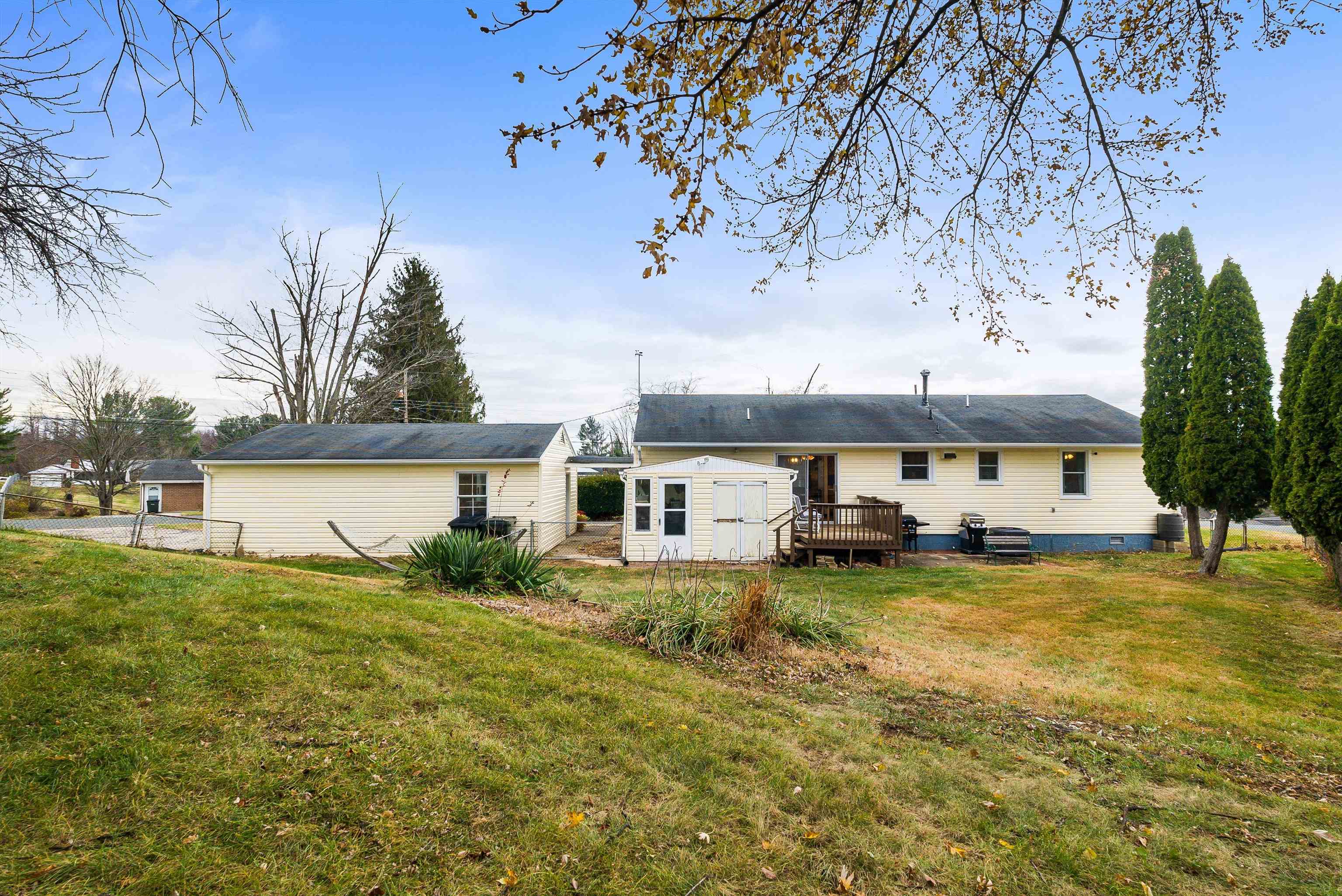 815 Rutherford Street Staunton, VA 24401 - Photo 45 of 56 a view of a house with a yard and sitting area