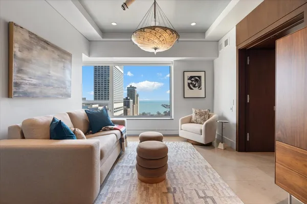 a living room with furniture and a large window