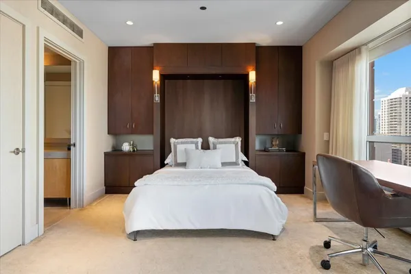 a bedroom with a bed and furniture