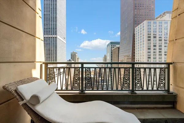 a view of balcony with furniture