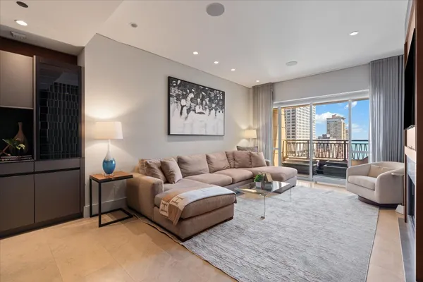 a living room with furniture and a large window