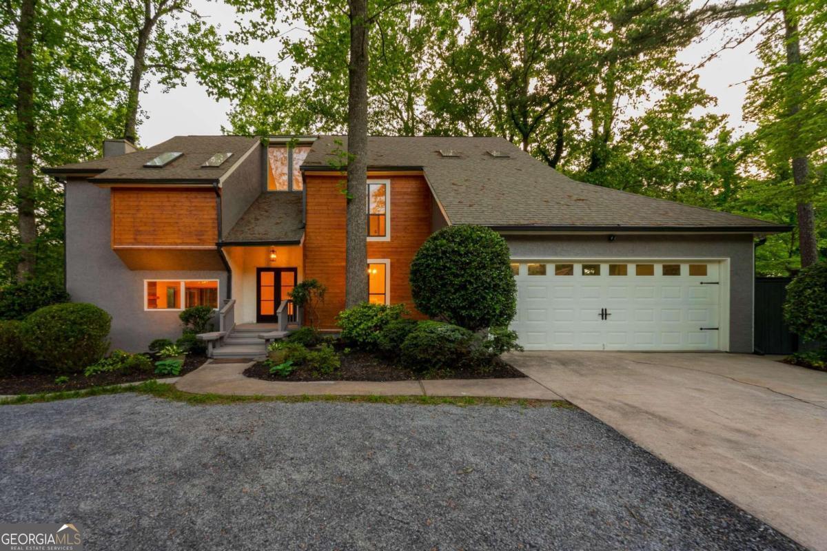 200 Old Tree Trace Roswell, GA 30075 - Photo 1 of 1 a front view of a house with a garden