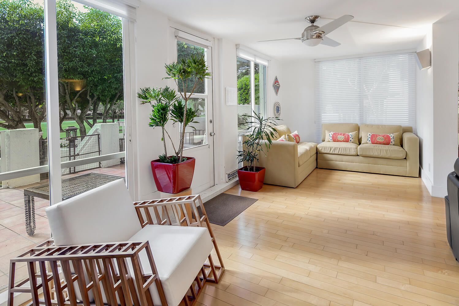 7369 Orangewood Lane, Unit 108 Boca Raton, FL 33433 - Photo 23 of 66 a living room with furniture and potted plants