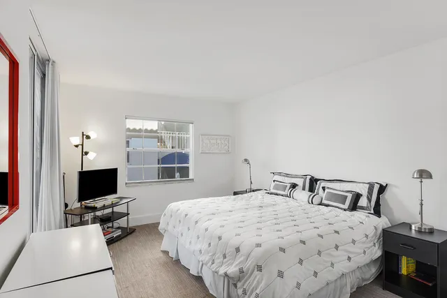 a view of a garden with flowers and trees