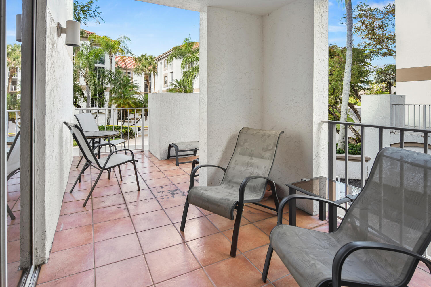 7369 Orangewood Lane, Unit 108 Boca Raton, FL 33433 - Photo 32 of 66 a view of a balcony with furniture