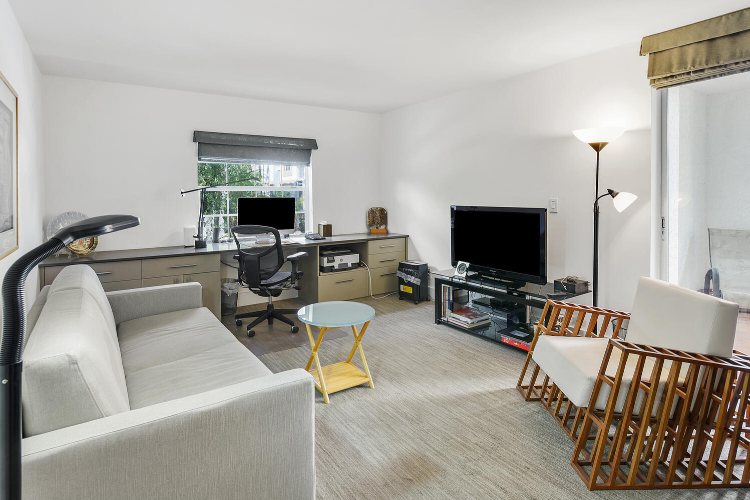 7369 Orangewood Lane, Unit 108 Boca Raton, FL 33433 - Photo 33 of 66 a living room with furniture and a flat screen tv
