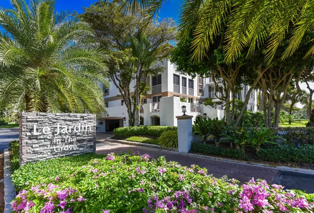 an aerial view of multiple houses with yard