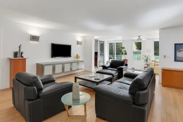 a large kitchen with stainless steel appliances granite countertop a sink and cabinets