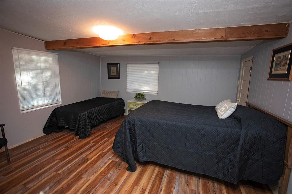 9051 Lacy Road Graford, TX 76449 - Photo 14 of 23 a bedroom with a bed and window