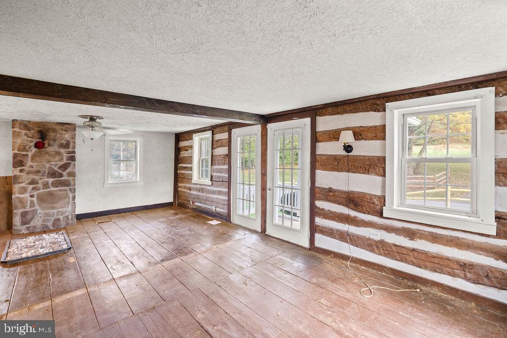 2860 Mayberry Road Taneytown, MD 21787 - Photo 4 of 31 a view of a livingroom with wooden floor and cabinet