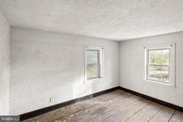 an empty room with windows