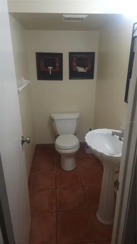 a bathroom with a toilet and a sink