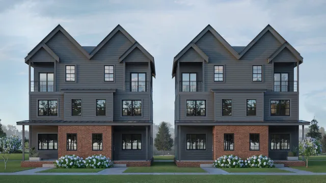 a front view of building with yard and green space