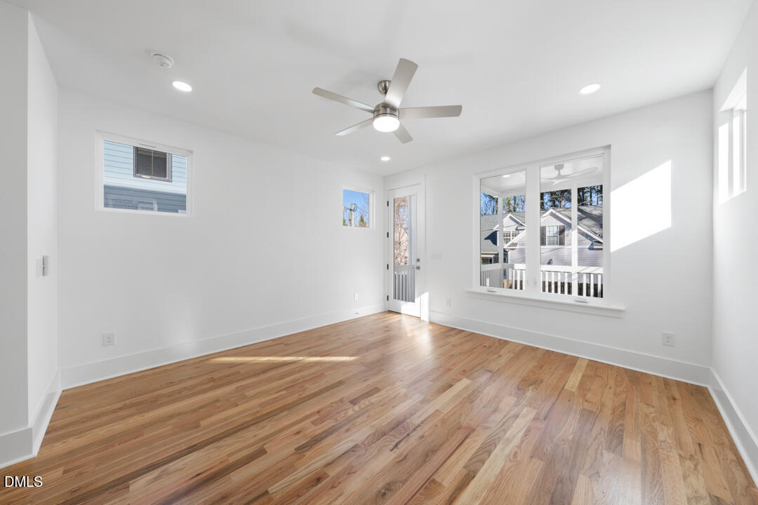 2530 West Wilson Street Durham, NC 27705 - Photo 23 of 49 a view of an empty room with window and wooden floor