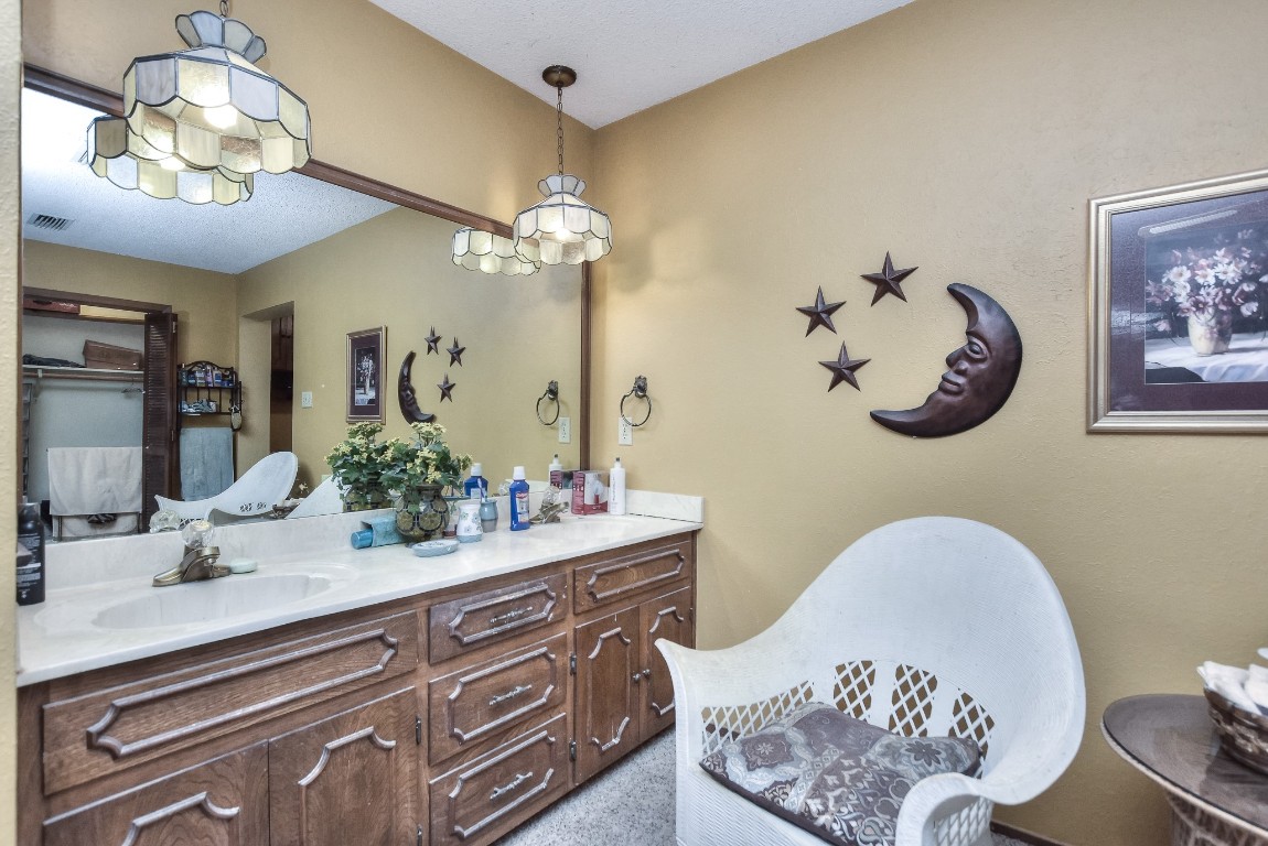 118 Oak Ridge Circle Georgetown, TX 78628 - Photo 22 of 40 a bathroom with a double vanity sink and a mirror