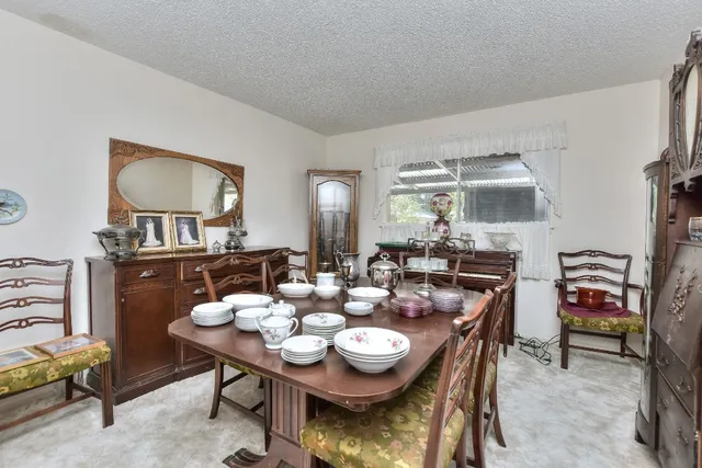 a view of a dining room with furniture and a livingroom