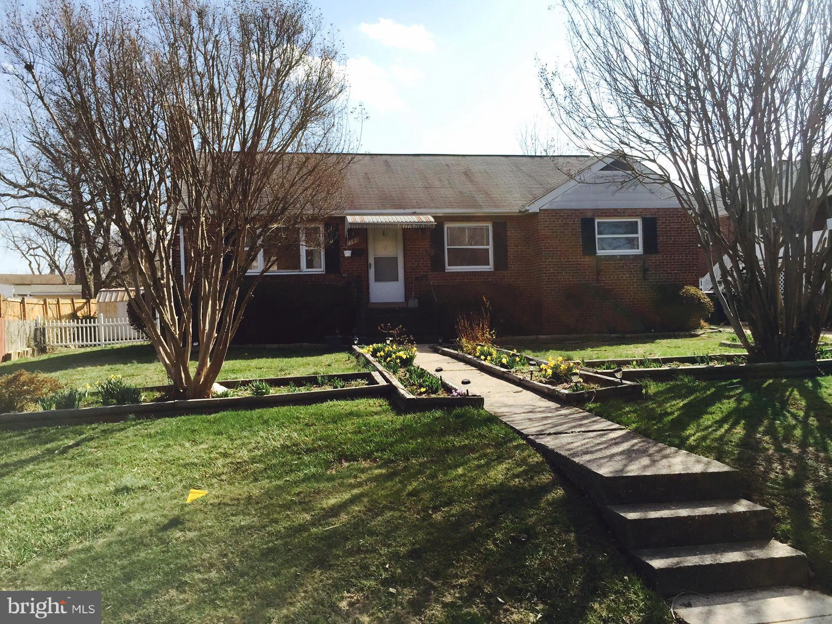 7102 Highland Street Springfield, VA 22150 - Photo 1 of 1 a view of a house with a yard
