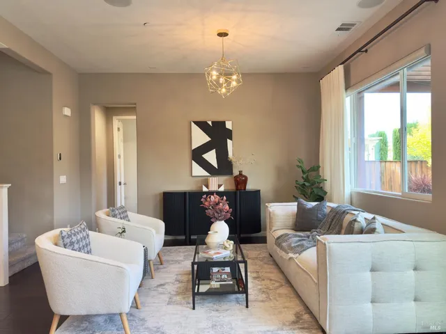 a view of a dining room with furniture window and outside view