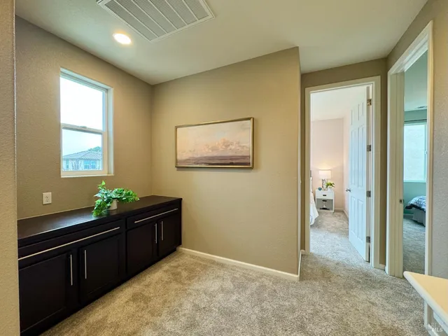 a bedroom with furniture and window