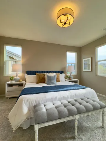 a bedroom with a bed and a table