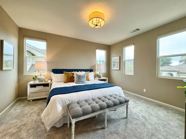 a bathroom with a sink a large mirror and a shower