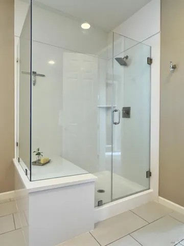 a view of a patio with a table and chairs