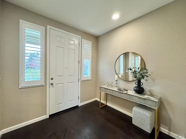 a view of a livingroom with furniture and wooden floor