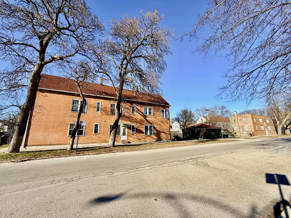 a view of car parked on the side of the road