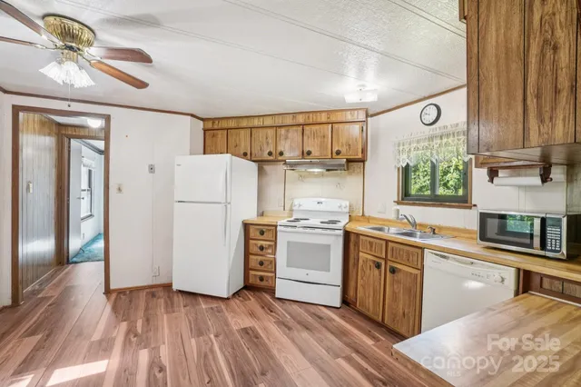 a kitchen with a refrigerator and a sink