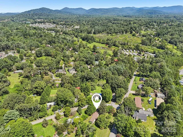 a view of a garden with an outdoor seating