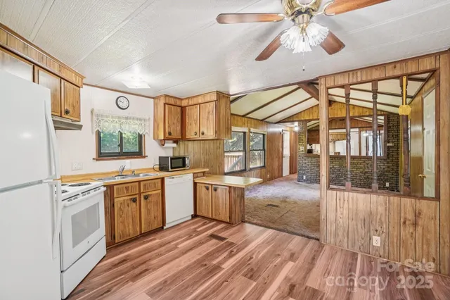 a kitchen with a stove a sink and a refrigerator