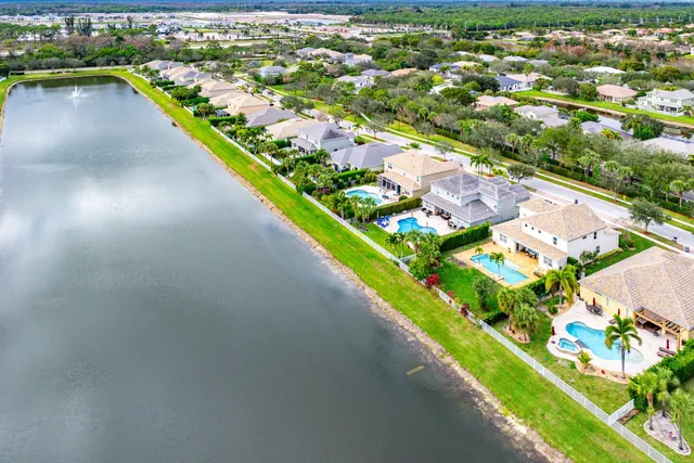 an aerial view of a city and lake view