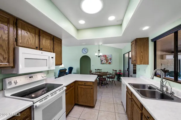 a en suite bathroom with a double vanity sink and a mirror