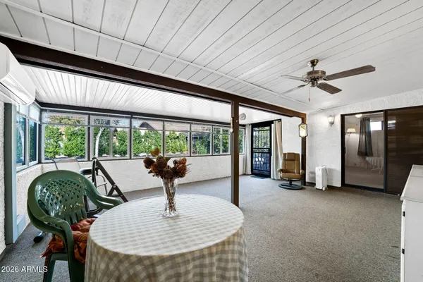 a view of a big yard with an outdoor space and seating