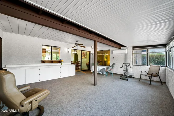 a very nice looking dining room with many windows